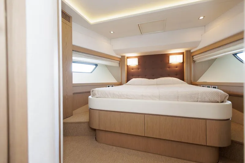 M/y Em-es II Yacht Photos Pics Luxurious bedroom interior of 2013 Ferretti Yachts 750 HT with modern design and cozy lighting.