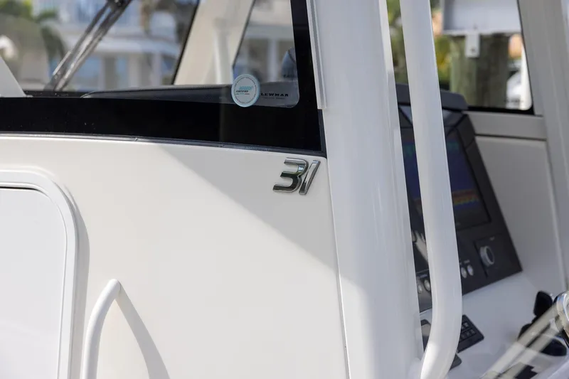  Yacht Photos Pics 2021 Regulator 31 boat console with sleek design and modern controls.