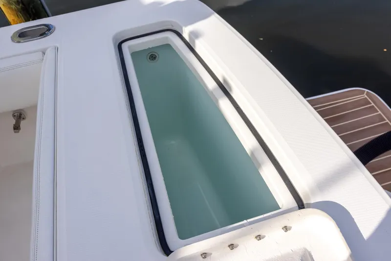  Yacht Photos Pics Livewell on 2021 Regulator 31 boat, featuring sleek white design and spacious interior.