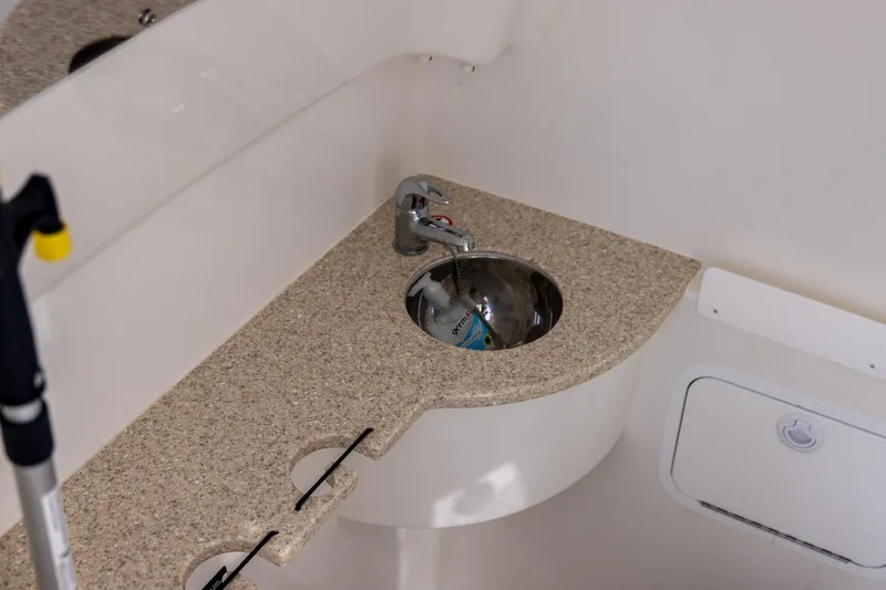  Yacht Photos Pics 2021 Regulator 31 boat interior with compact sink and countertop.