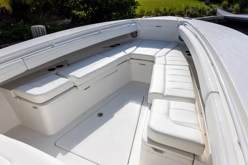  Yacht Photos Pics Luxurious seating area on a 2021 Regulator 31 boat, featuring white cushioned benches.