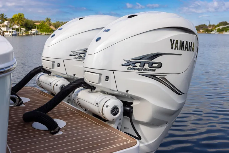  Yacht Photos Pics Twin Yamaha XTO Offshore engines on a 2021 Regulator 31 boat, docked on calm water.