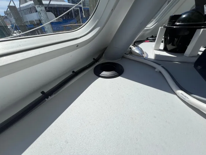 Lady Grace Yacht Photos Pics Interior view of 2022 Wesmac 38 boat, showing dashboard and window details.