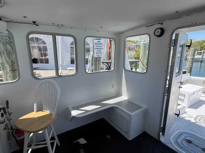 Lady Grace Yacht Photos Pics Interior of 2022 Wesmac 38 boat with seating and windows.