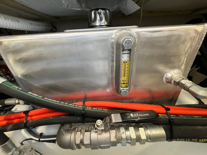 Lady Grace Yacht Photos Pics Engine compartment of 2022 Wesmac 38 with fuel tank and hoses.