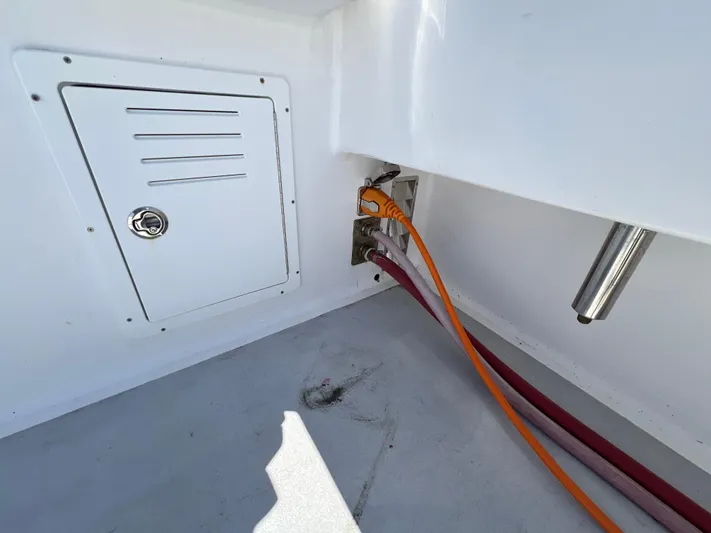 Lady Grace Yacht Photos Pics 2022 Wesmac 38 boat interior with cables and storage compartment.