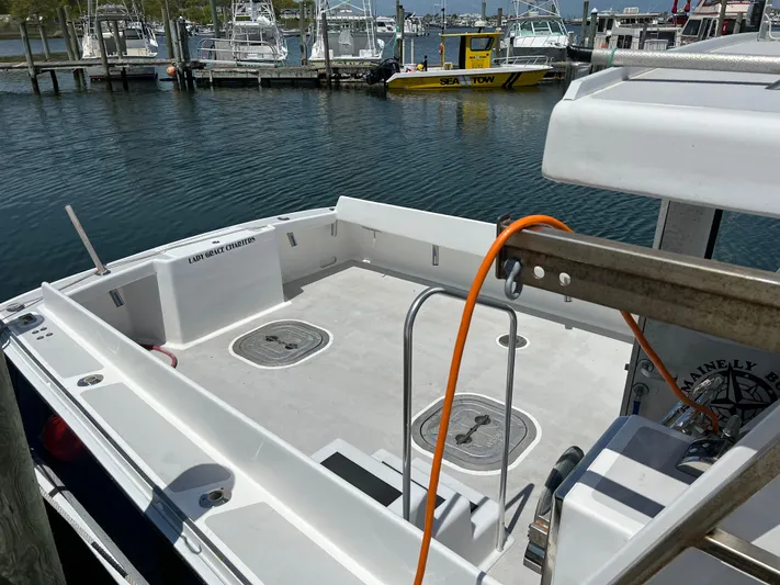 Lady Grace Yacht Photos Pics Wesmac 38 boat deck, 2022 model, docked at marina with clear water view.
