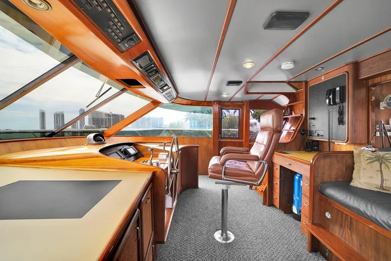 Stealin Time Yacht Photos Pics Luxurious interior of 1991 Jones-Goodell Yachtfish with leather seating and modern navigation equipment.