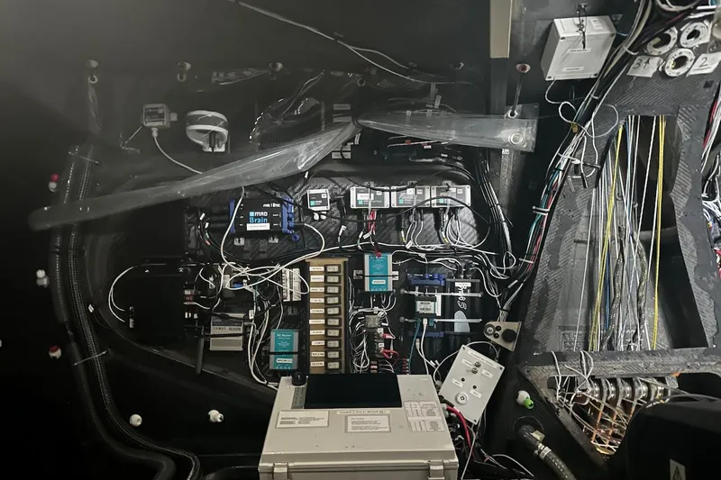 Prysmian Yacht Photos Pics Electrical system inside a 2015 Multiplast Imoca 60 yacht, showcasing complex wiring and components.
