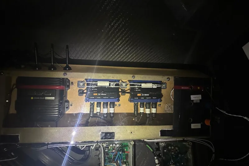 Prysmian Yacht Photos Pics Electrical panel inside a 2015 Multiplast Imoca 60 yacht, featuring various control units and wiring.