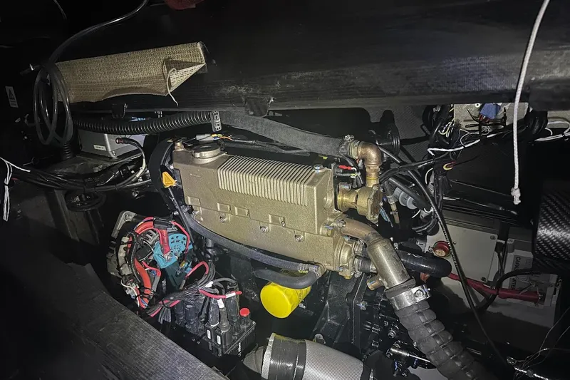 Prysmian Yacht Photos Pics Engine compartment of a 2015 Multiplast Imoca 60 yacht, showcasing intricate mechanical components.