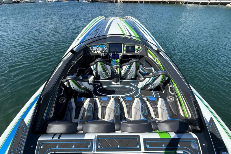  Yacht Photos Pics 2022 MTI 390X speedboat interior with sleek design and vibrant green accents.
