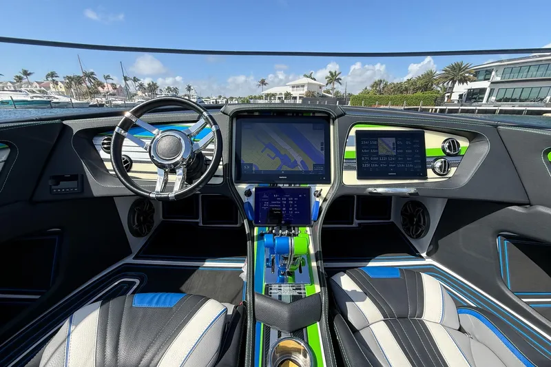  Yacht Photos Pics Interior of a 2022 MTI 390X boat with advanced navigation system and sleek design.