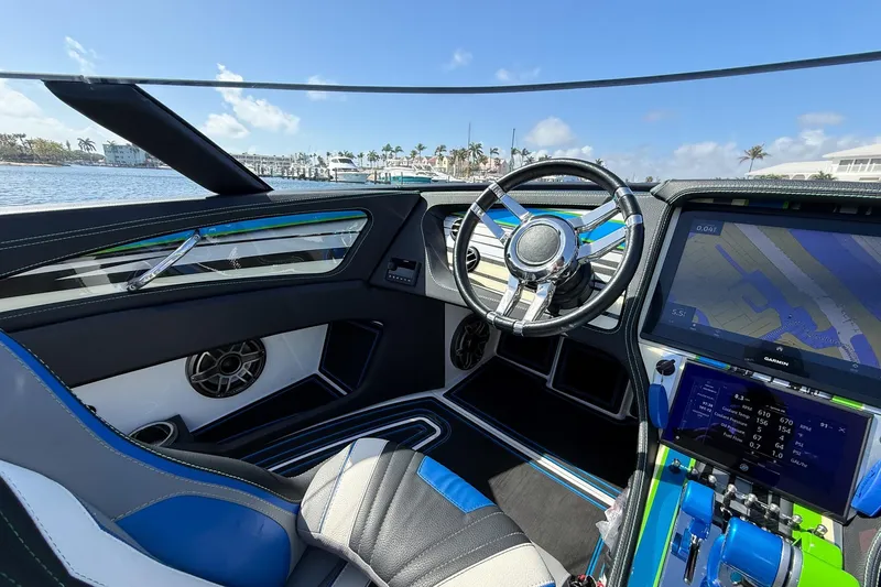  Yacht Photos Pics Interior of 2022 MTI 390X boat with modern steering and navigation system.