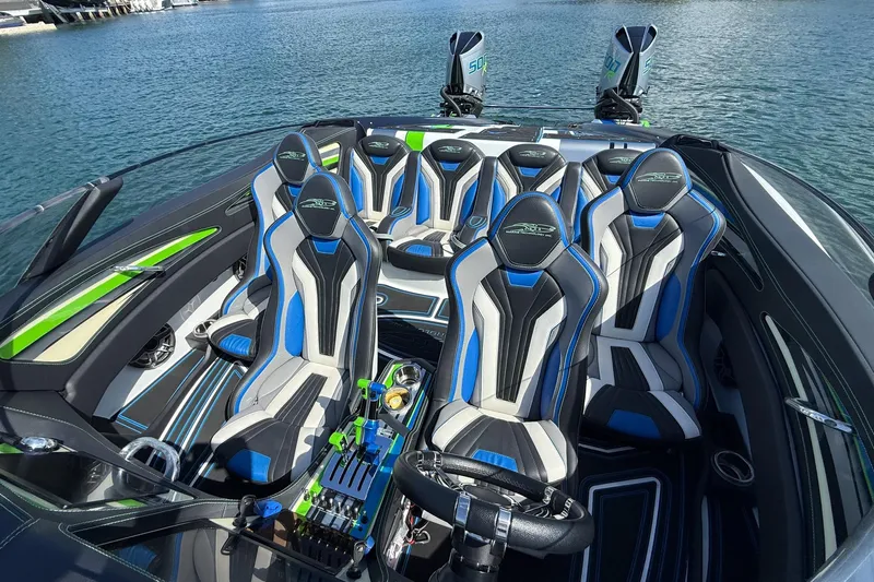  Yacht Photos Pics Luxury MTI 390X 2022 speedboat interior with stylish blue and gray seating.