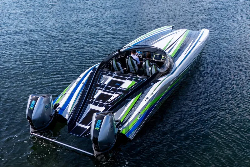  Yacht Photos Pics 2022 MTI 390X powerboat with vibrant stripes on water.