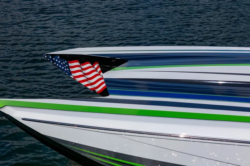  Yacht Photos Pics 2022 MTI 390X speedboat with American flag, sleek design on water.
