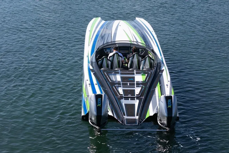  Yacht Photos Pics 2022 MTI 390X powerboat on water, featuring sleek design and vibrant colors.