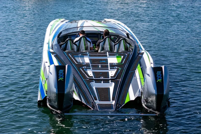  Yacht Photos Pics 2022 MTI 390X powerboat with vibrant design on calm water.