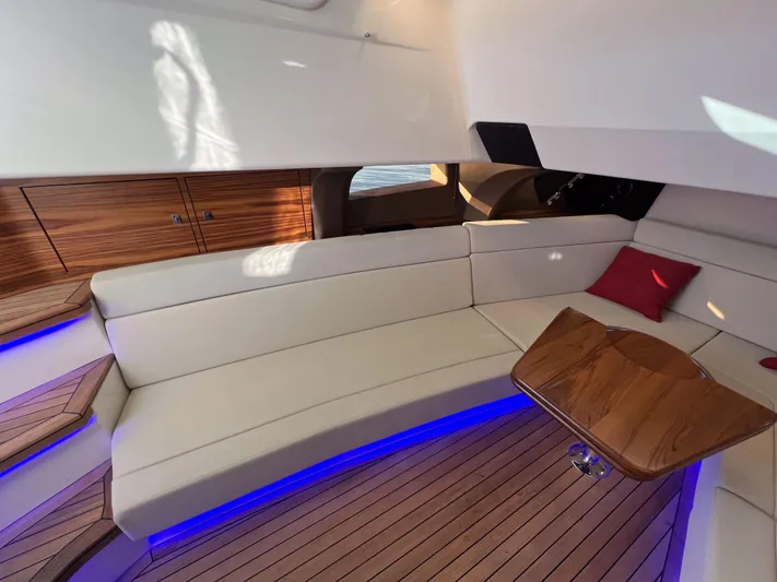  Yacht Photos Pics Luxurious interior of 2023 Boston Whaler 420 Outrage with elegant seating and ambient lighting.