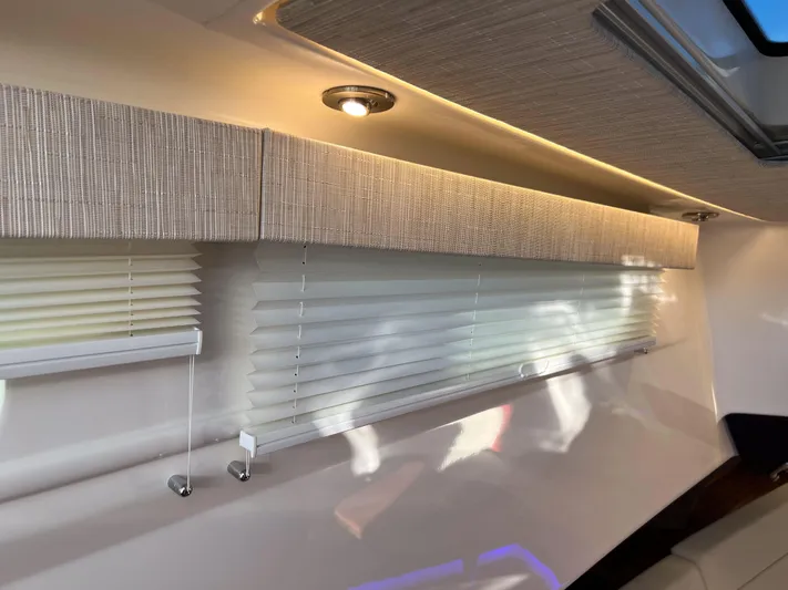  Yacht Photos Pics Interior of 2023 Boston Whaler 420 Outrage with modern blinds and ambient lighting.