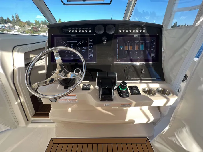  Yacht Photos Pics 2023 Boston Whaler 420 Outrage helm with advanced navigation displays and controls.