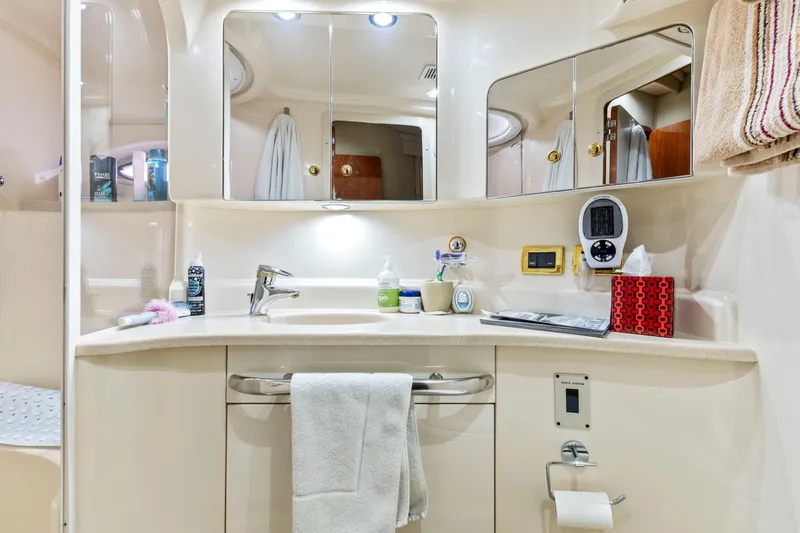 My Addiction Yacht Photos Pics Luxurious bathroom in 2001 Sea Ray Sundancer 510 yacht with modern amenities and elegant design.