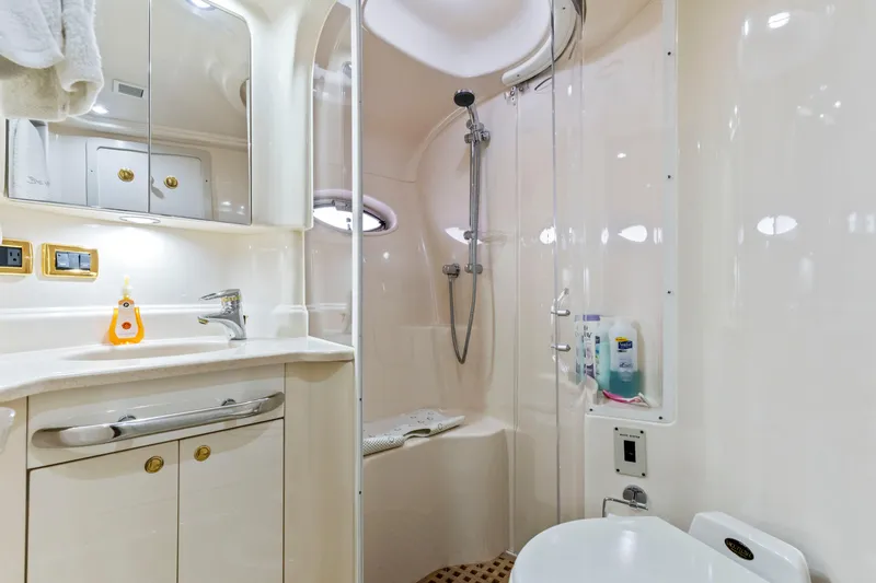 My Addiction Yacht Photos Pics Luxurious bathroom in 2001 Sea Ray Sundancer 510 yacht, featuring modern fixtures and elegant design.