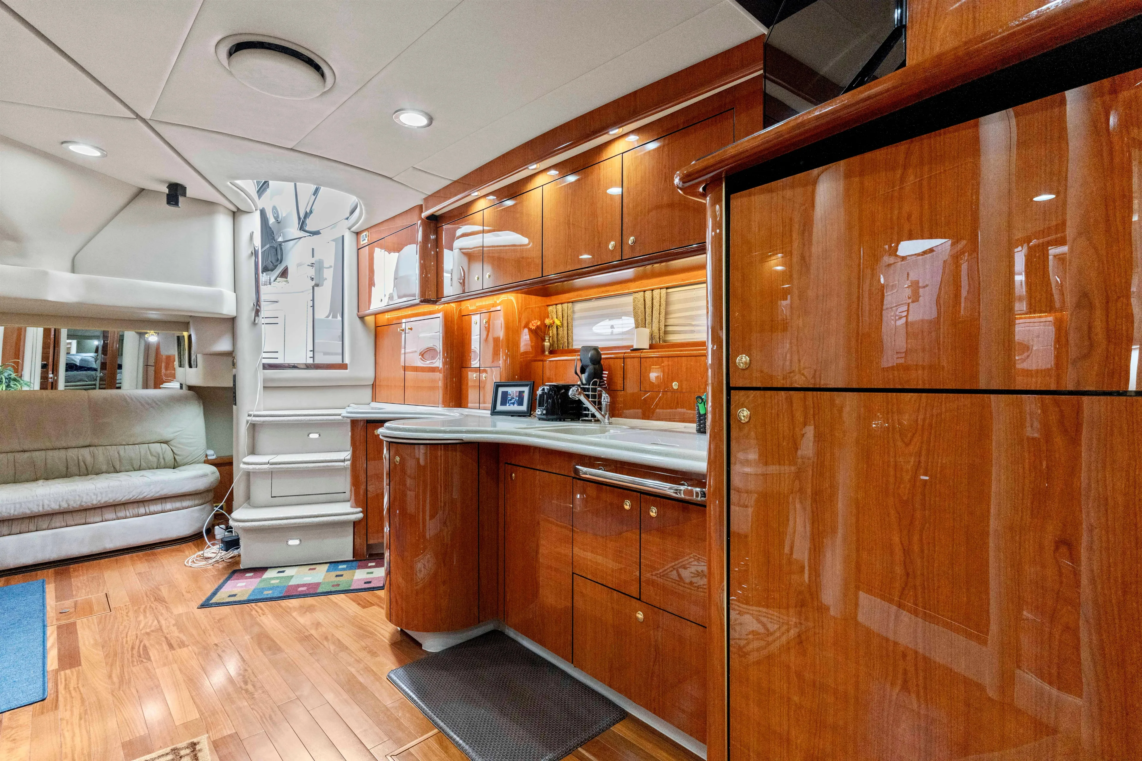 My Addiction Yacht Photos Pics Luxurious interior of 2001 Sea Ray Sundancer 510 yacht with polished wood cabinetry.
