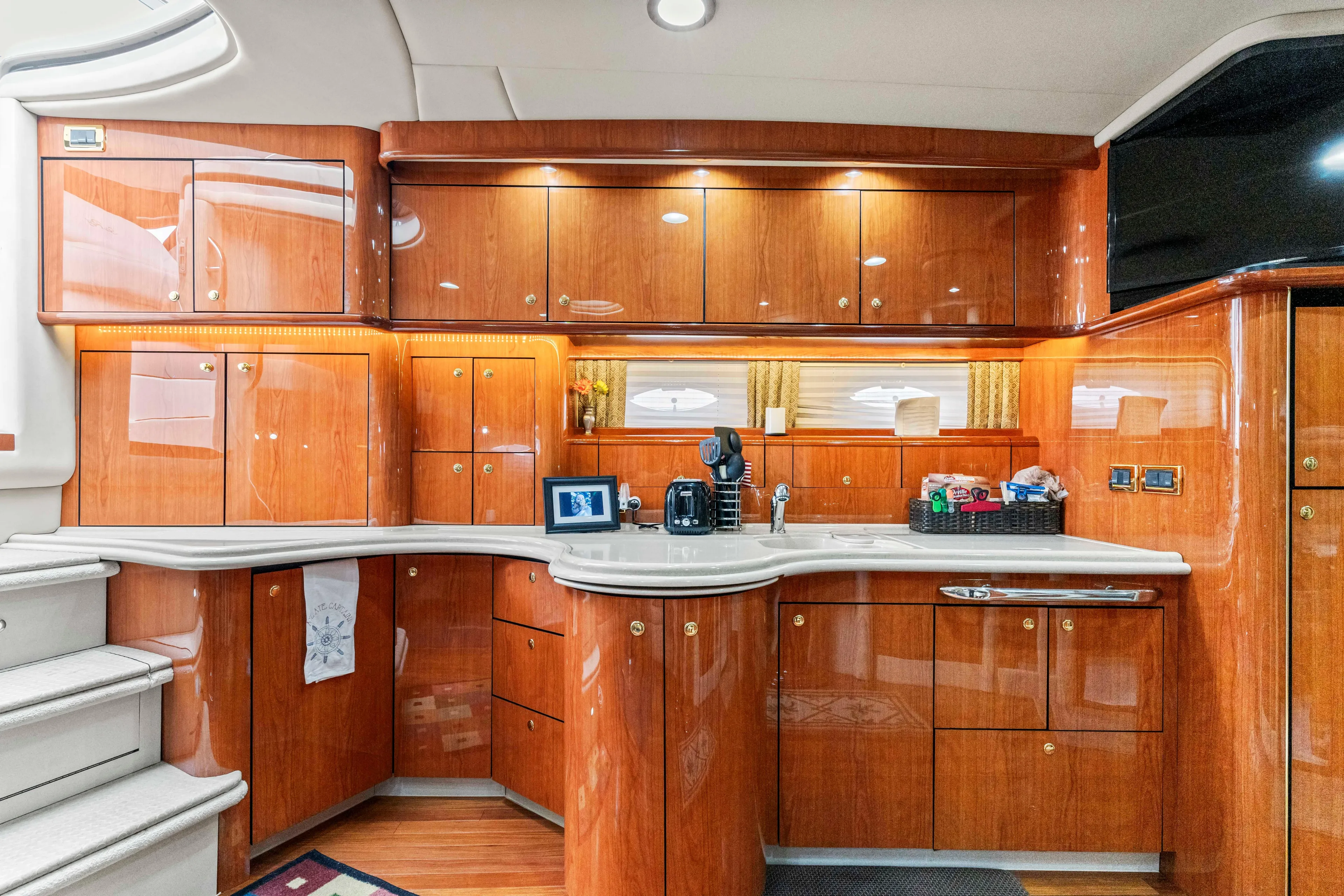 My Addiction Yacht Photos Pics Luxurious 2001 Sea Ray Sundancer 510 yacht interior with polished wood cabinetry and modern amenities.