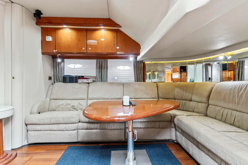 My Addiction Yacht Photos Pics Luxurious interior of 2001 Sea Ray Sundancer 510 yacht with plush seating and wooden accents.