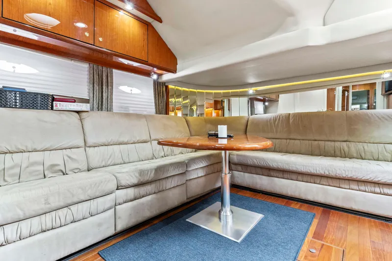 My Addiction Yacht Photos Pics Luxurious interior of 2001 Sea Ray Sundancer 510 yacht with plush seating and wooden table.