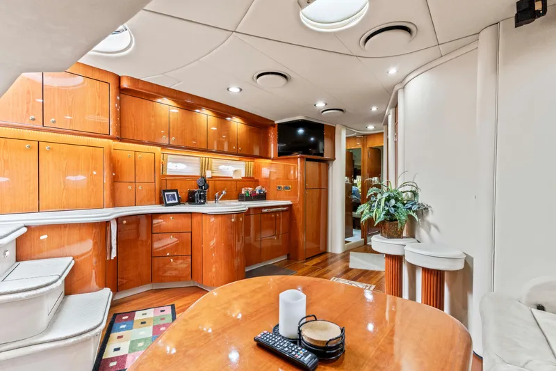 My Addiction Yacht Photos Pics Luxurious interior of 2001 Sea Ray Sundancer 510 yacht with elegant wood cabinetry.