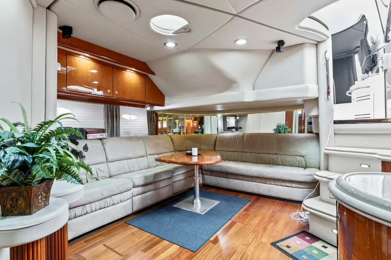 My Addiction Yacht Photos Pics Luxurious interior of 2001 Sea Ray Sundancer 510 yacht with plush seating and elegant decor.