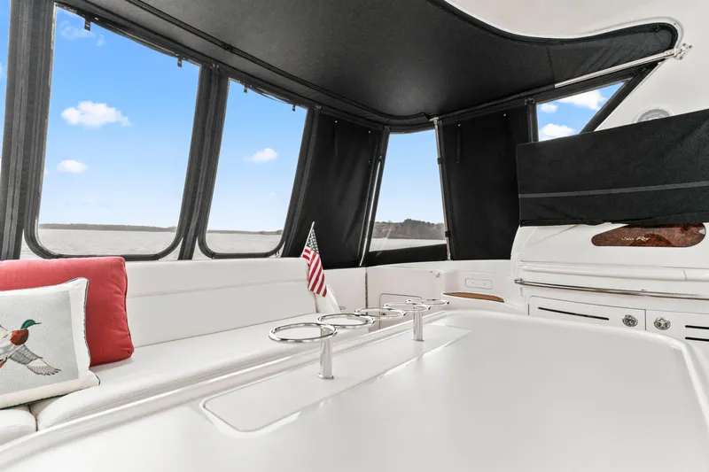 My Addiction Yacht Photos Pics Interior of 2001 Sea Ray Sundancer 510 yacht with seating and American flag.