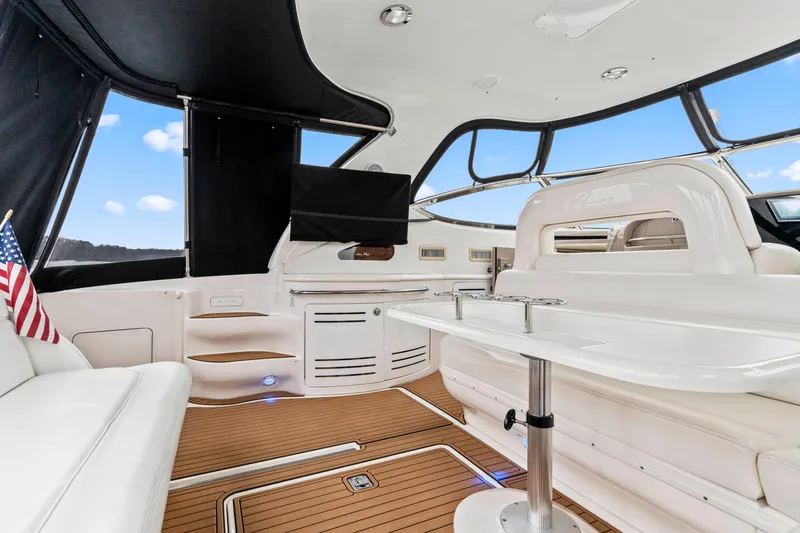 My Addiction Yacht Photos Pics Luxurious interior of 2001 Sea Ray Sundancer 510 yacht with elegant seating and table.