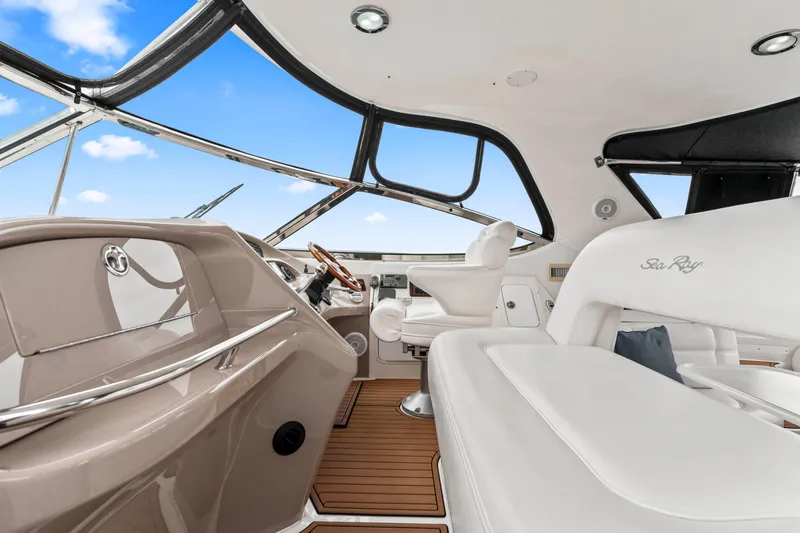 My Addiction Yacht Photos Pics Interior of 2001 Sea Ray Sundancer 510 yacht with luxurious seating and modern helm.