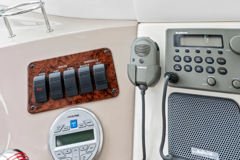 My Addiction Yacht Photos Pics Control panel of a 2001 Sea Ray Sundancer 510 with switches and communication equipment.