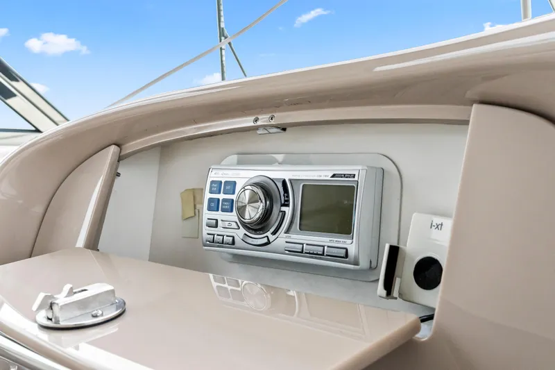My Addiction Yacht Photos Pics 2001 Sea Ray Sundancer 510 stereo system with control panel, under clear blue sky.