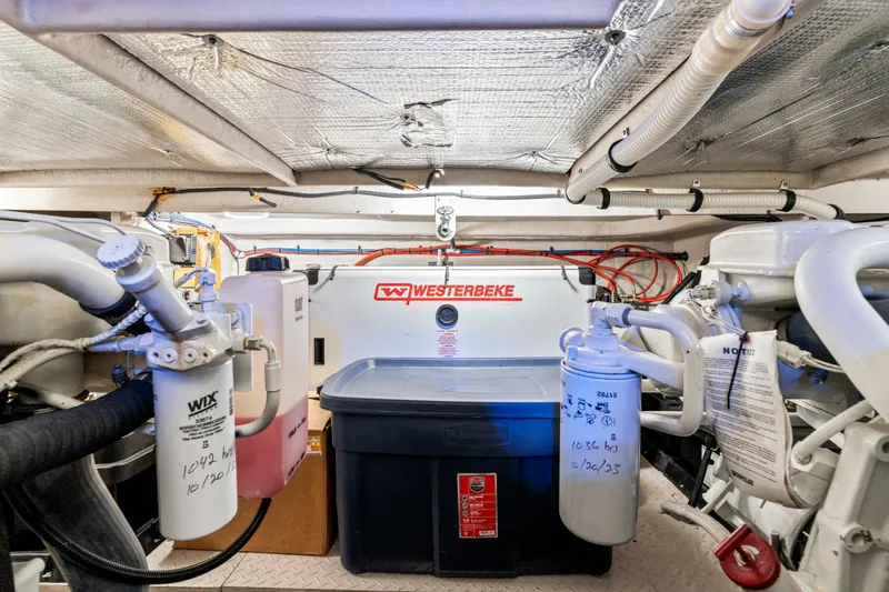 My Addiction Yacht Photos Pics Engine room of a 2001 Sea Ray Sundancer 510 with Westerbeke generator and filters.