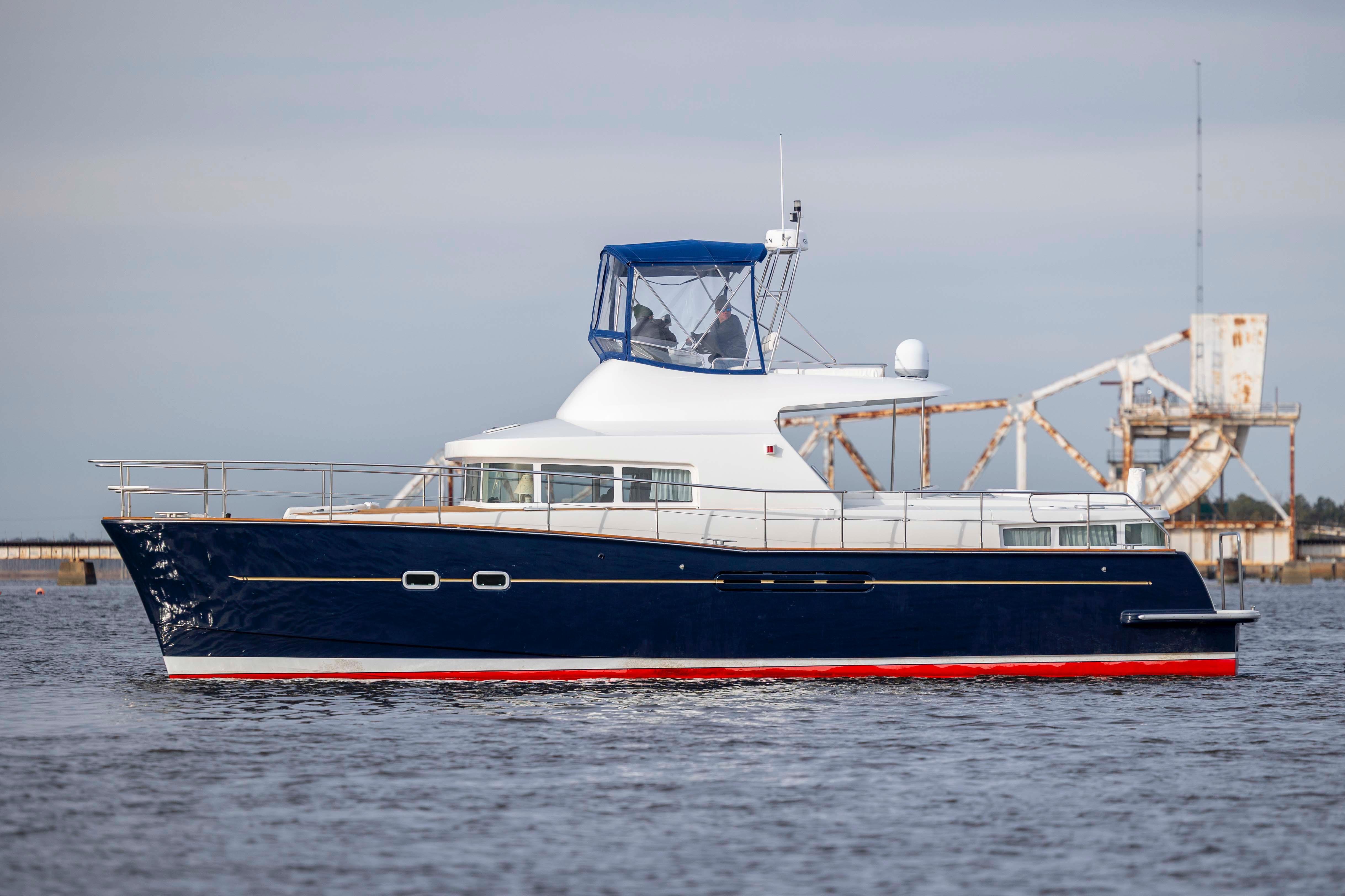 2004 Lagoon 43 PC yacht on water, featuring sleek design and blue hull.