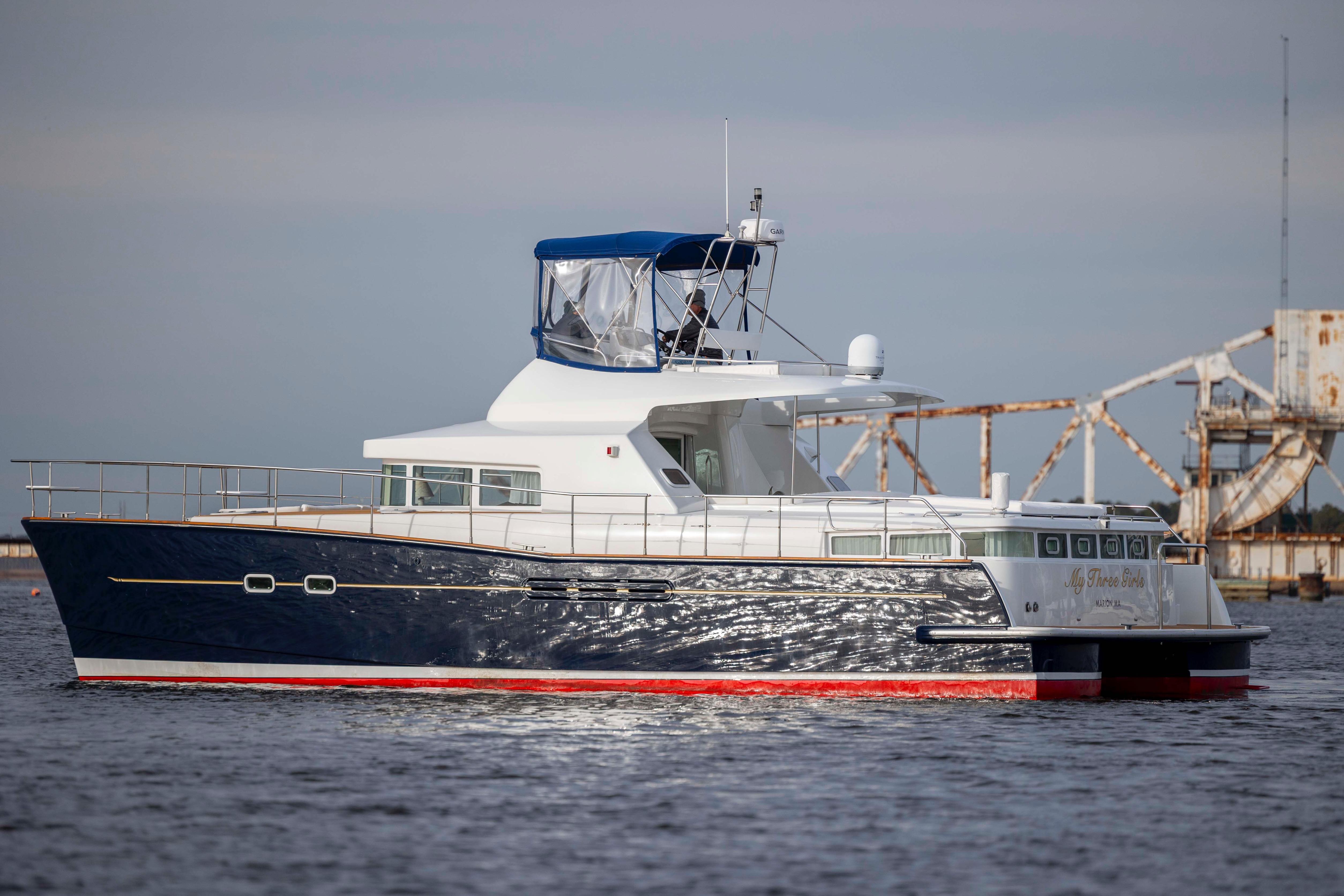 2004 Lagoon 43 PC yacht on water, featuring sleek design and blue hull.