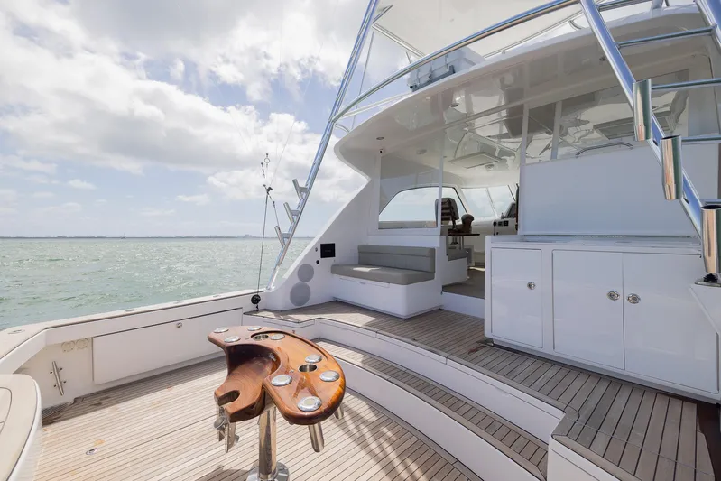  Yacht Photos Pics Luxury Bertram 50 yacht deck with seating, ocean view, and fishing rod holders, 2022 model.