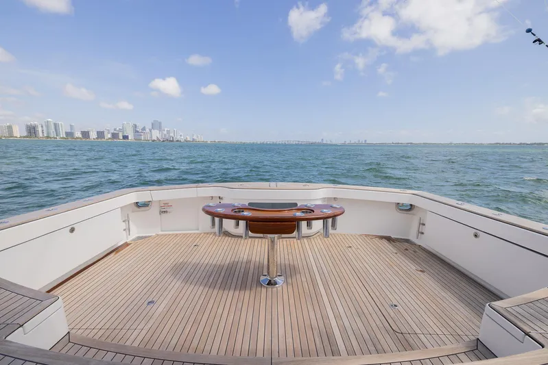  Yacht Photos Pics Bertram 50 yacht deck overlooking ocean with city skyline, 2022 model.
