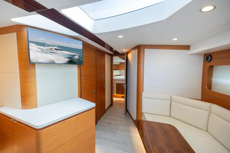  Yacht Photos Pics Luxurious interior of a 2022 Bertram 50 yacht with modern furnishings and skylight.