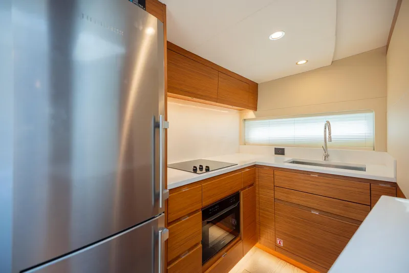  Yacht Photos Pics Modern kitchen interior on 2022 Bertram 50 yacht with stainless steel appliances.