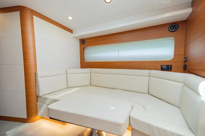  Yacht Photos Pics Luxurious interior of 2022 Bertram 50 yacht with white leather seating.