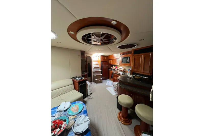  Yacht Photos Pics Luxurious interior of 2007 Cruisers Yachts 560 Express with elegant wood finishes and modern amenities.