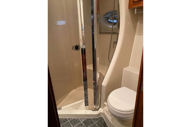  Yacht Photos Pics Bathroom interior of 2007 Cruisers Yachts 560 Express with shower and toilet.