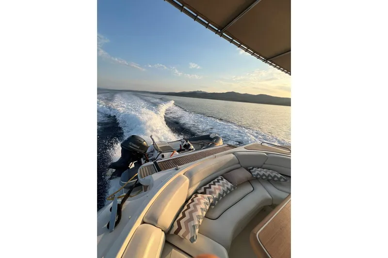  Yacht Photos Pics 2007 Cruisers Yachts 560 Express cruising at sunset with scenic ocean view.